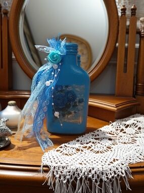 Decorative Blue Glass Bottle with Ribbon Accent